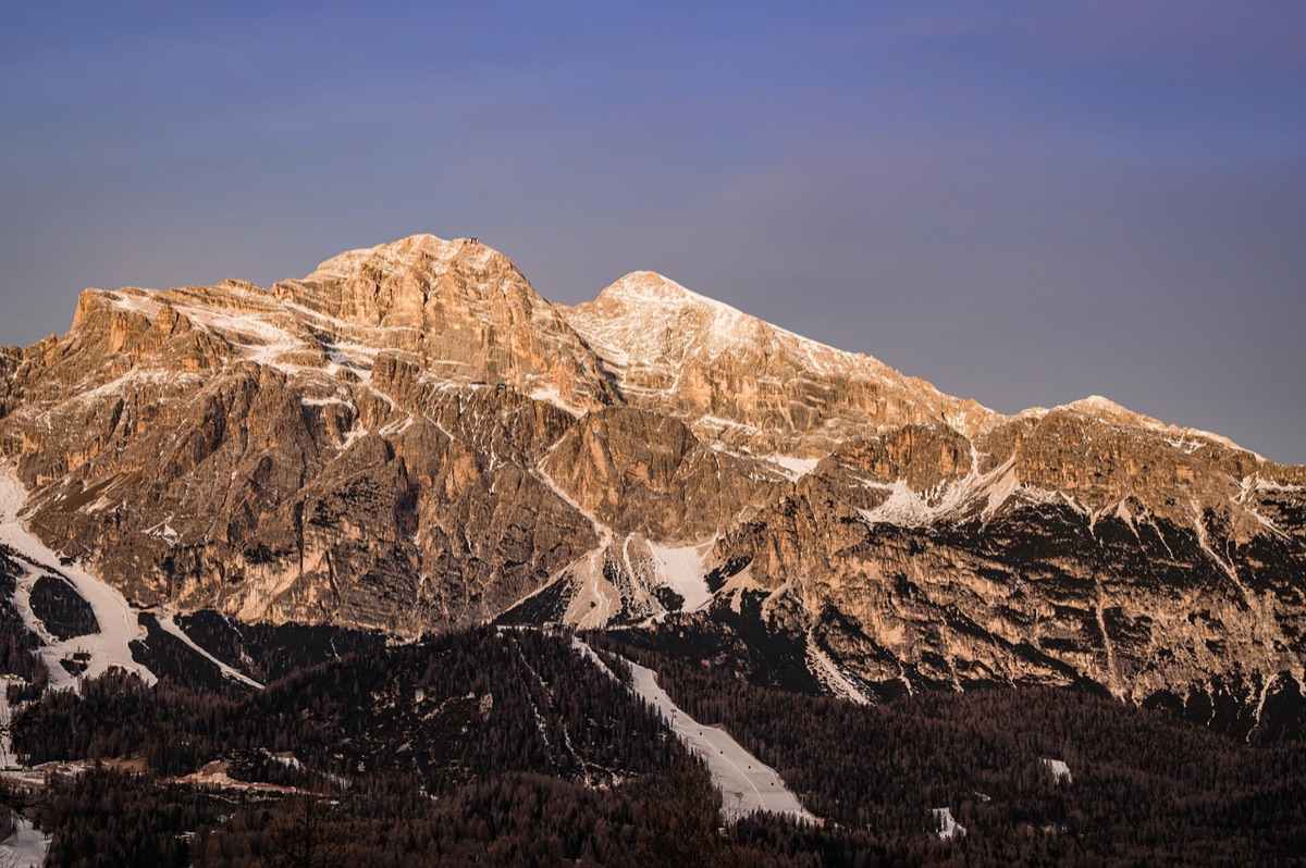 Snow-covered mountain range at sunrise