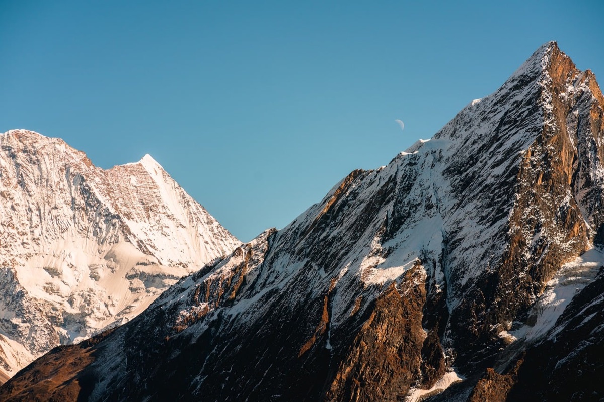 Alpine refuge with tent and backpack