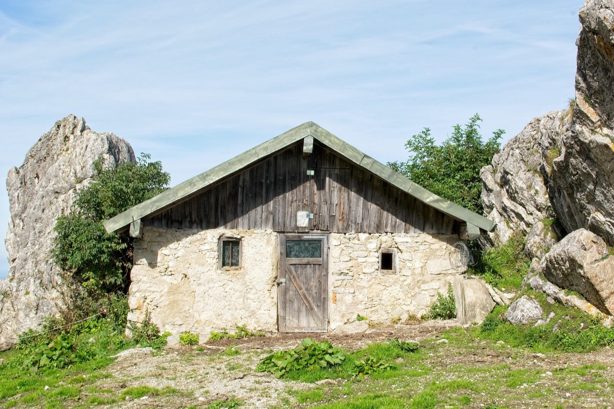 Hiker sleeping in alpine hut
