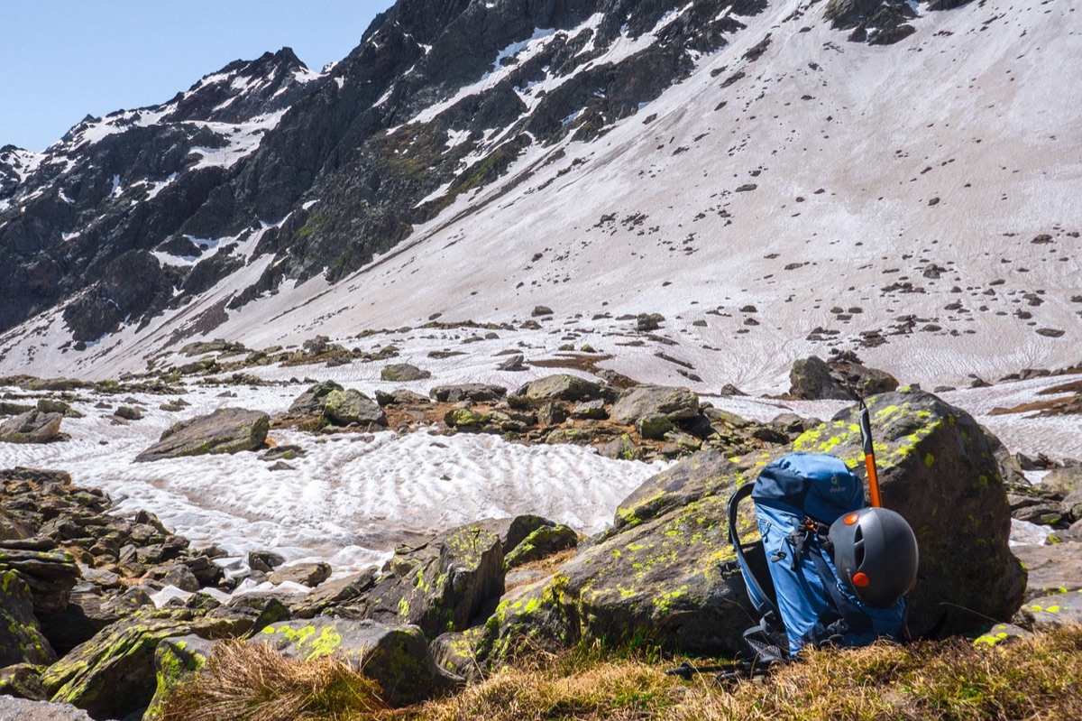 Alpine refuge with tent and backpack