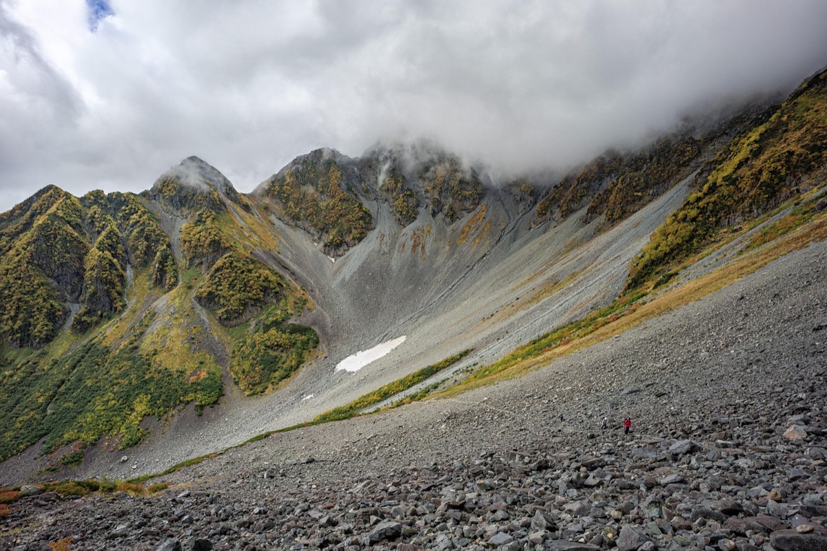Alpine tent on rocky slope