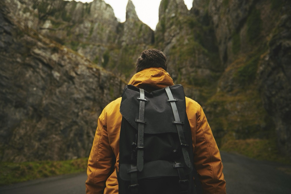 Hiker with oxygen tank at high altitude