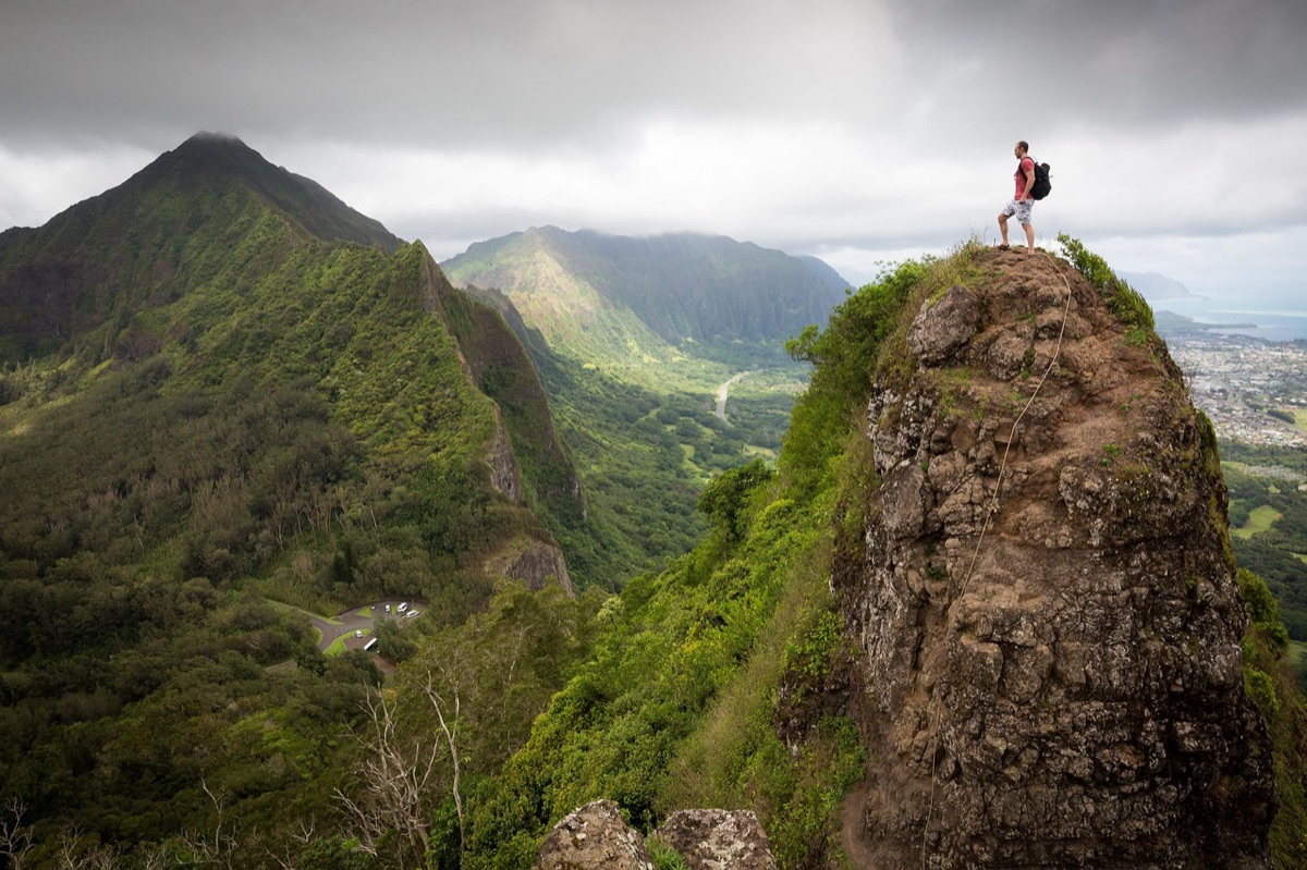 Hiker standing on mountain summit