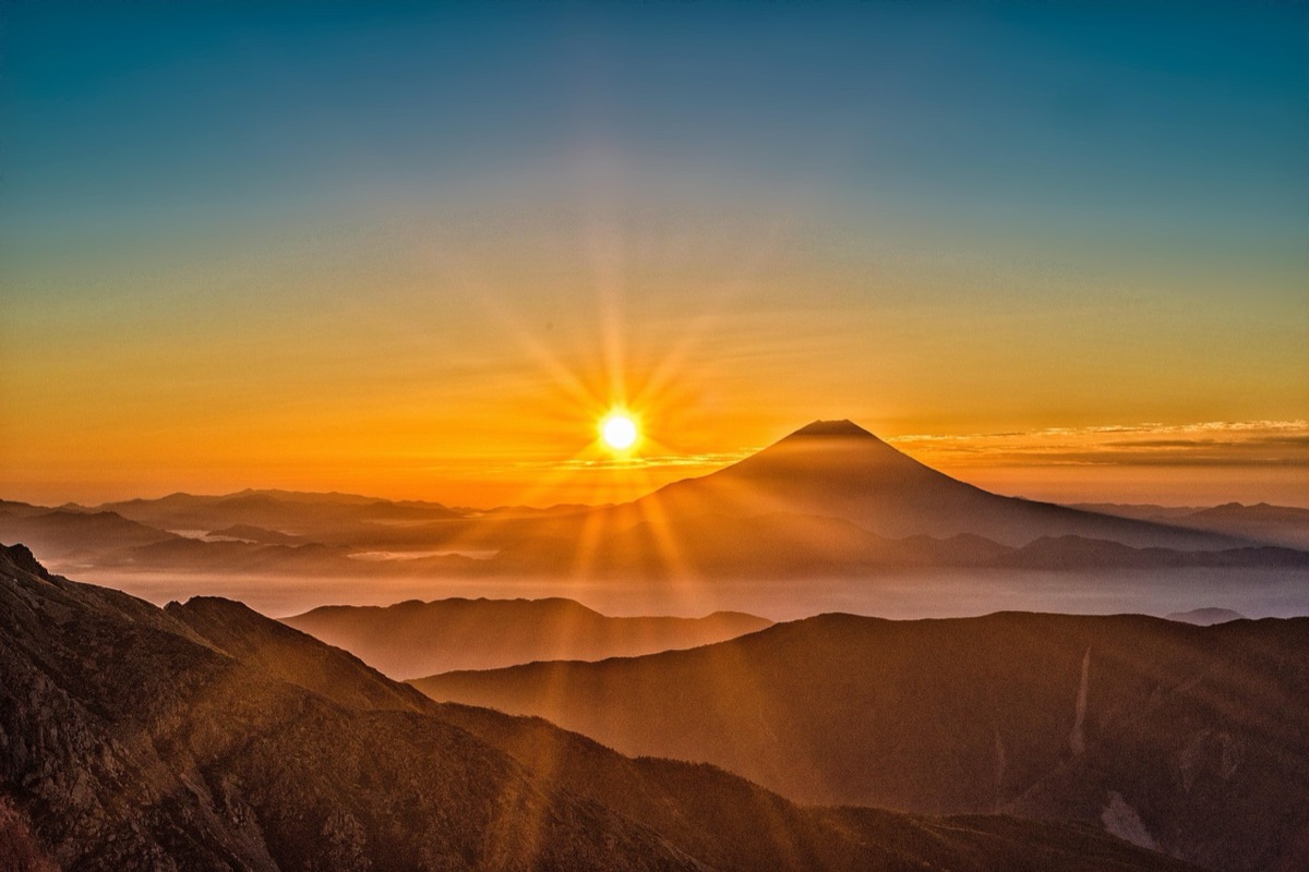 Hiker with backpack at Fuji mountain trail